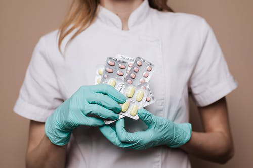 A nurse holding medicines