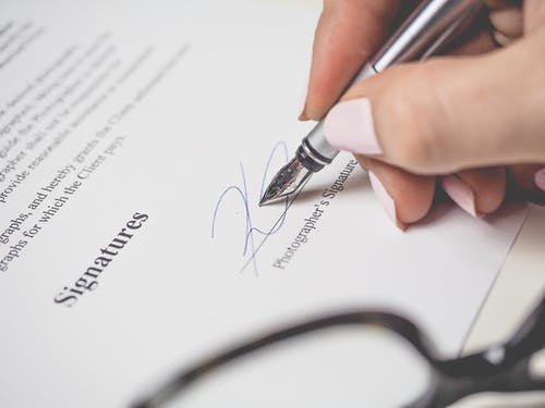 a person signing a legal document