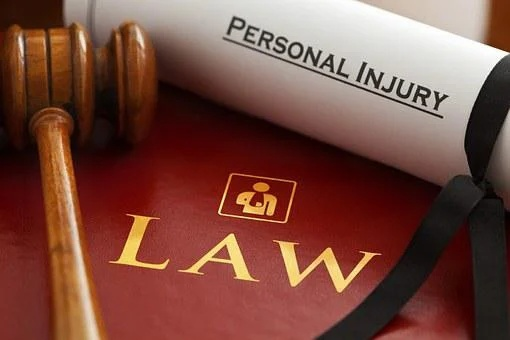  Picture of personal injury document next to a hammer
