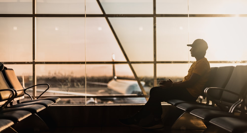 A person waiting at an airport.