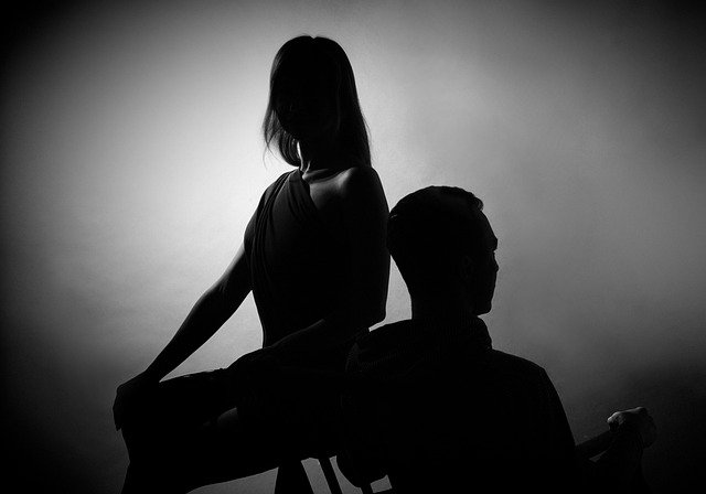 A man and woman sitting on the chair