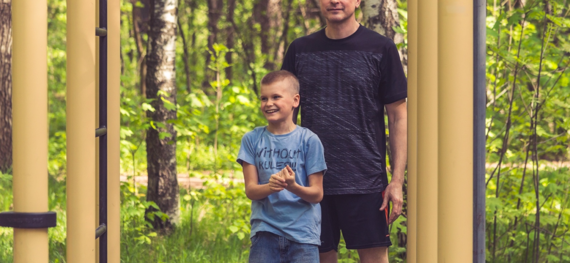 a father and son out in a forest