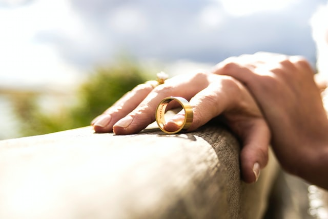 A woman holding an engagement ring