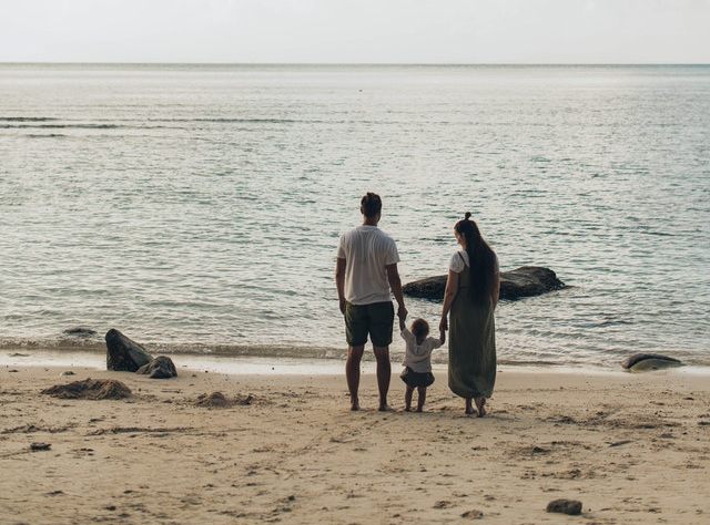 Parents with their child on the beach