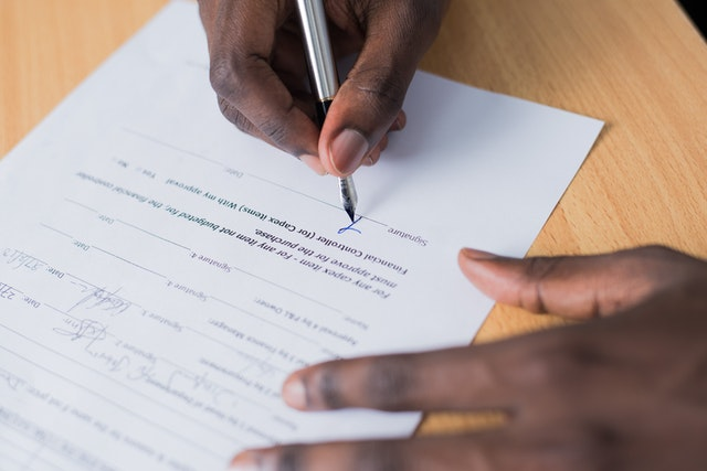 An individual completing an immigration application