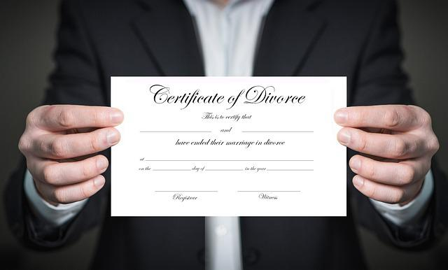 A lawyer holding a divorce certificate