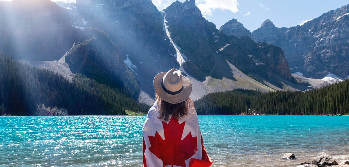 A person holding a Canadian flag