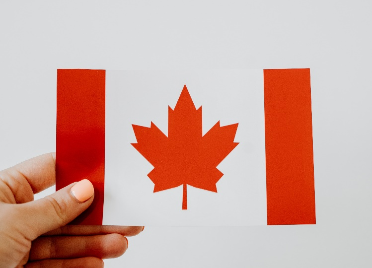 A person holding a Canadian flag.