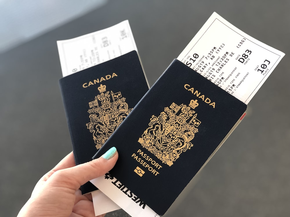 Person holding Canadian passports