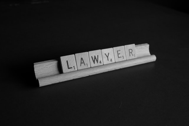 Lawyer spelled out using scrabble tiles