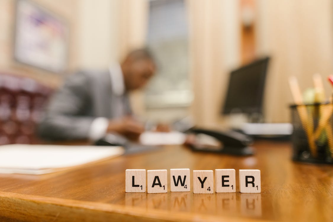 Blocks saying lawyer on a table