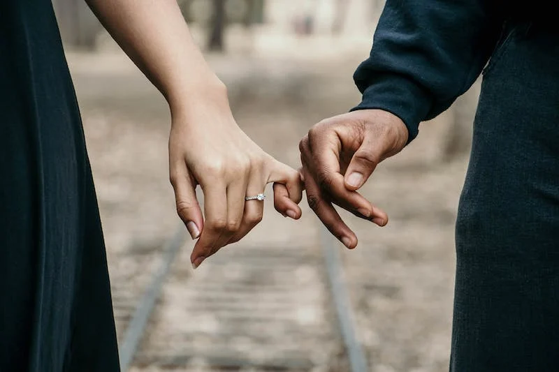 a couple with linked fingers