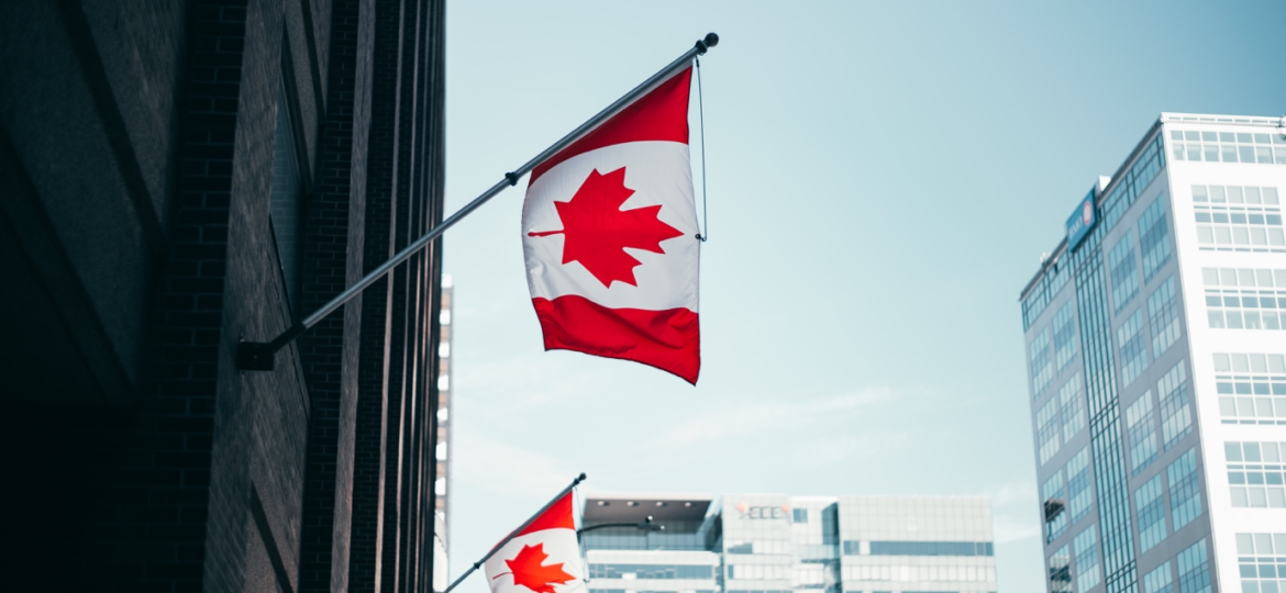Canadian flags hoisted on a building