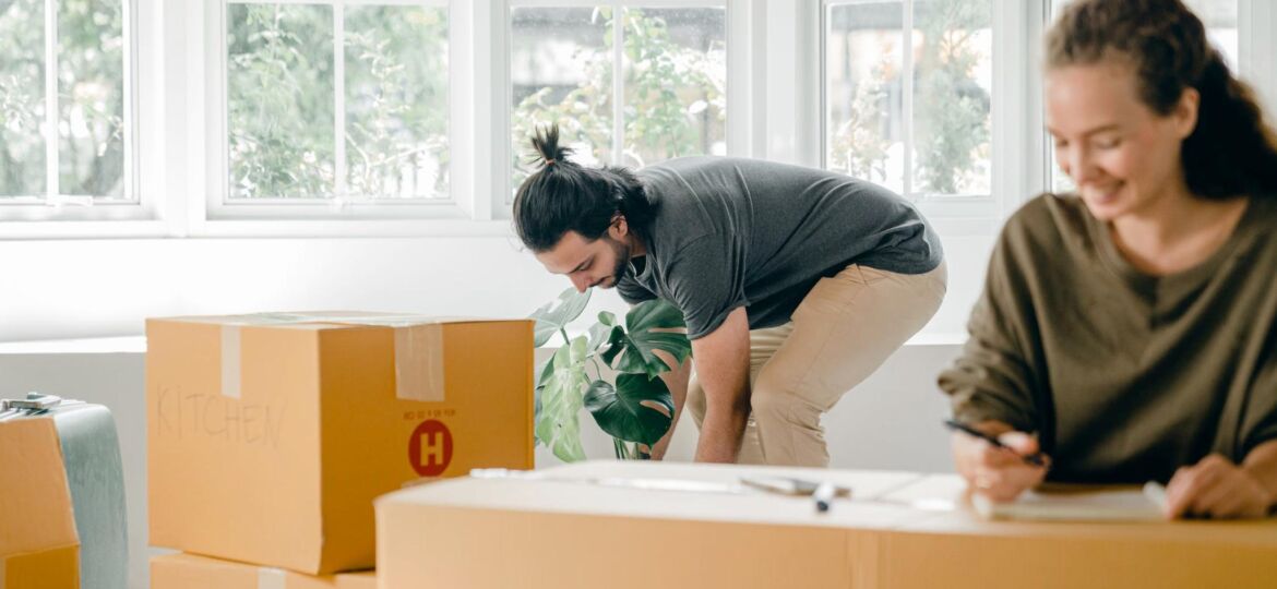 An image of a couple unpacking boxes at home