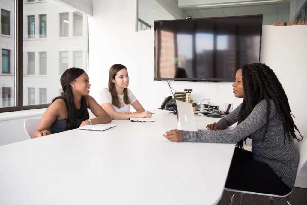 An image of women in a meeting room