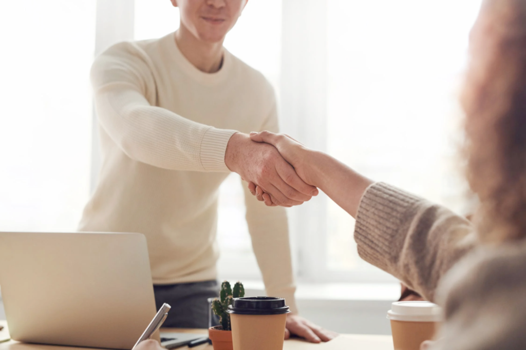 An image of two people shaking hands