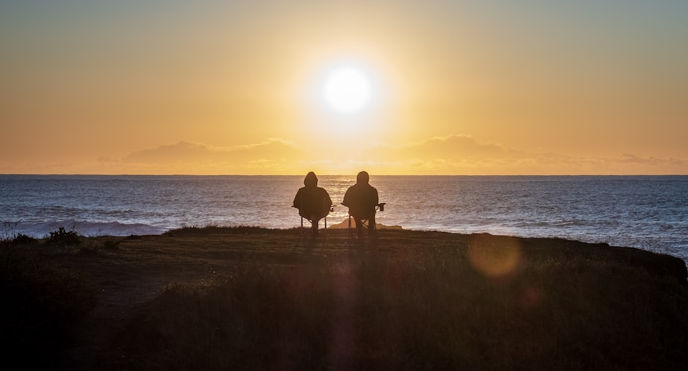 a couple watching the sunset
