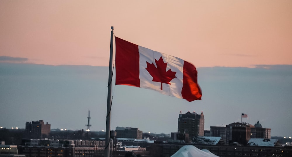 the Canadian flag on a rooftop