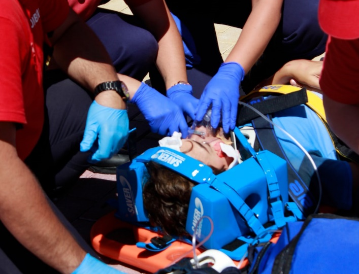 medical personnel helping an injured person
