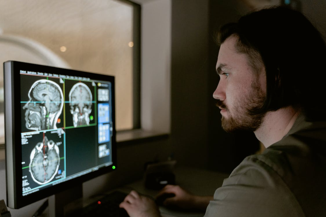 A person looking at brain scans