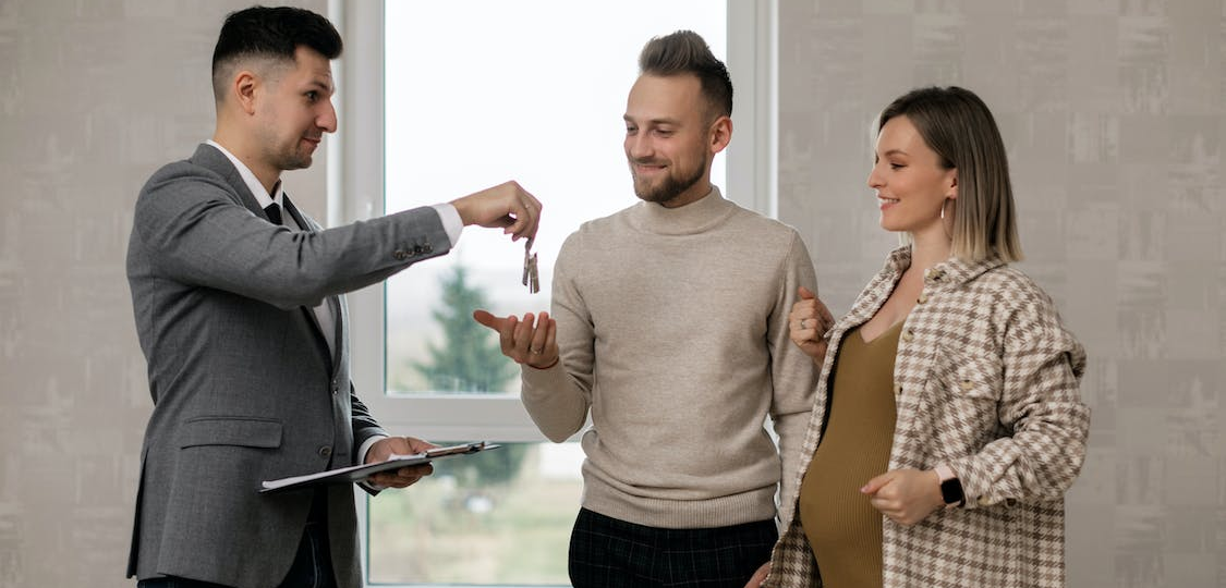 A real estate lawyer handing over keys